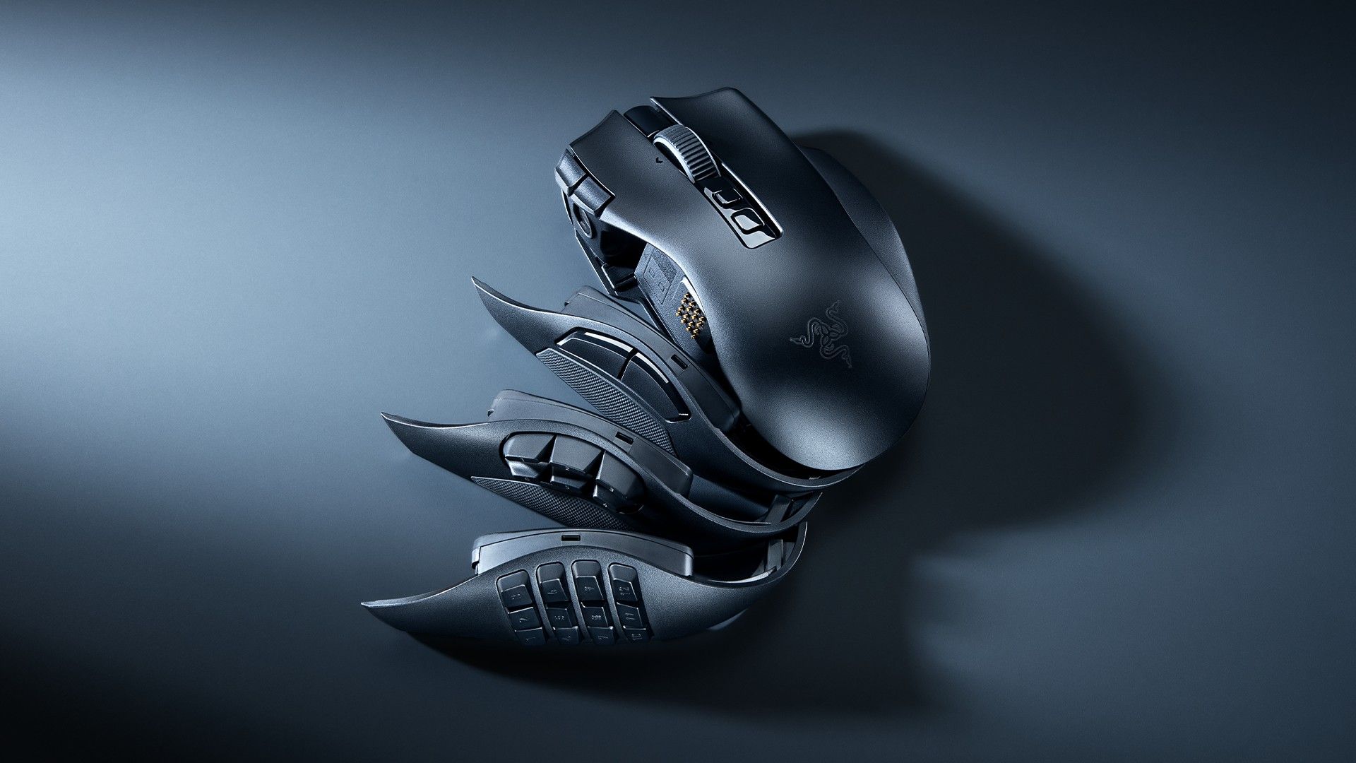 Razer Naga V3 Pro gaming mouse with swappable side panels arranged on a gray background